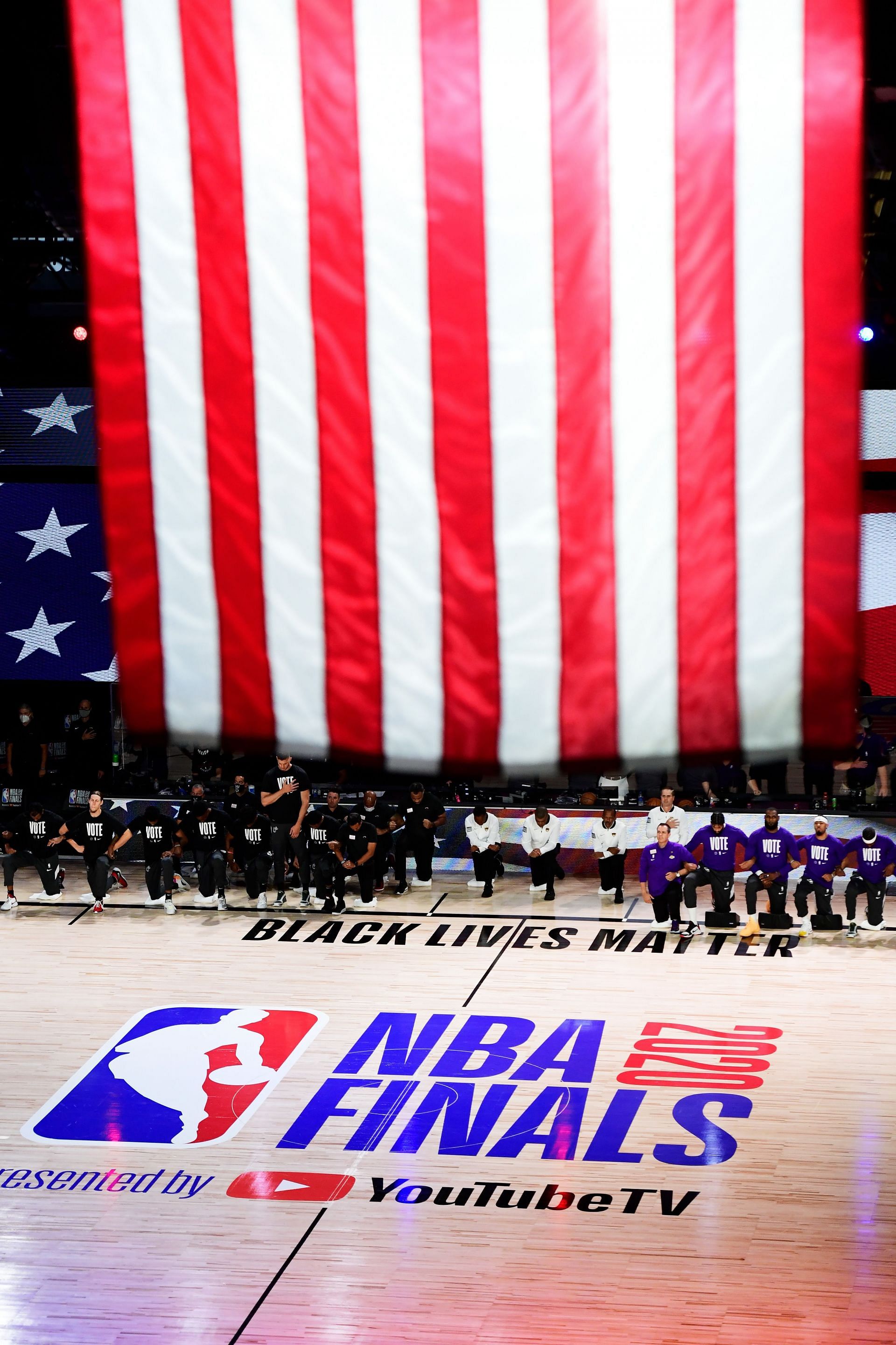 The LA Lakers and the Miami Heat kneel during the National Anthem before the start of the Game Six of the 2020 Finals - Source: Getty